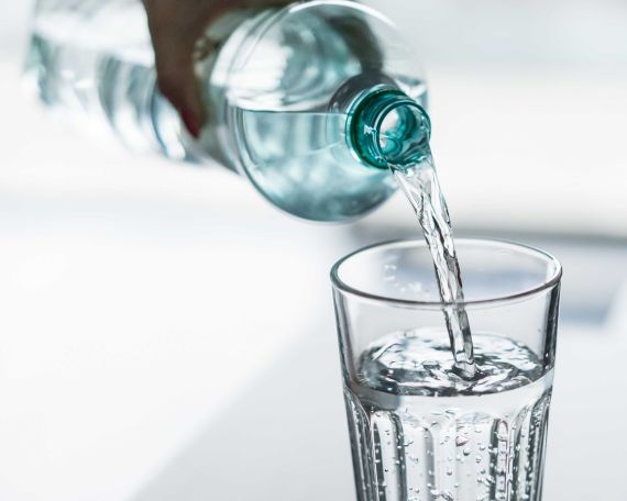 pouring-water-from-pet-bottle-into-a-glass-picjumbo-com.jpg